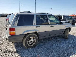 1997 Jeep Grand Cherokee Laredo with VIN 1J4GZ58S5VC561060, listed as a Copart auction lot 52098315 with 267,245 mi miles and Salvage title. Bid and sale history available at DreamBid. Image 3.