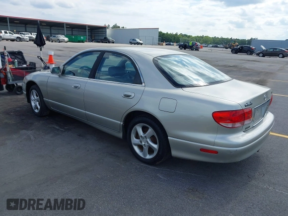 2002 Mazda Millenia with VIN JM1TA221721722364, listed as a IAAI auction lot 42160683 with 166,778 mi miles and . Bid and sale history available at DreamBid. Image 3.