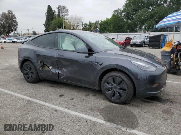 2025 Tesla Model Y Long Range with VIN 7SAYGDED8SF277469, listed as a Copart auction lot 45600195 with 442 mi miles and Salvage Title. Bid and sale history available at DreamBid. Image 4.