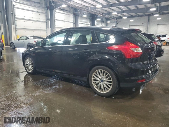 2014 Ford Focus Titanium with VIN 1FADP3N2XEL131392, listed as a Copart auction lot 61665025 with 105,597 mi miles and Salvage title. Bid and sale history available at DreamBid. Image 2.