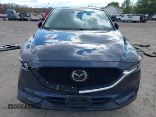 2019 Mazda CX-5 Grand Touring with VIN JM3KFBDM2K0603400, listed as a IAAI auction lot 42051135 with 59,448 mi miles and . Bid and sale history available at DreamBid. Image 12.