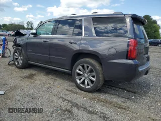 2015 Chevrolet Tahoe LTZ with VIN 1GNSKCKC9FR698924, listed as a Copart auction lot 56196895 with 184,740 mi miles and Salvage title. Bid and sale history available at DreamBid. Image 2.