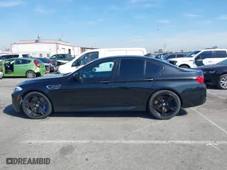2013 BMW M5 with VIN WBSFV9C54DC772568, listed as a IAAI auction lot 41866486 with 99,072 mi miles. Bid and sale history available at carsss.com. Image 14.