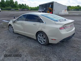 2014 Lincoln MKZ z VIN 3LN6L2G96ER833211, wystawiony jako IAAI lot #42352364 z przebiegiem 46 834 mil mil oraz . Historia ofert i sprzedaży dostępna na DreamBid. Obrazek 3.
