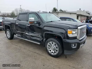 2015 GMC Sierra 2500HD Denali with VIN 1GT120EG1FF668772, listed as a Copart auction lot 84406604 with 113,260 mi miles and Salvage Title. Bid and sale history available at carsss.com. Image 4.