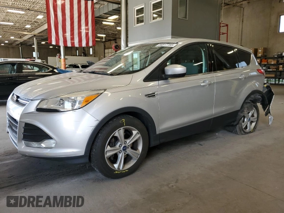 2013 Ford Escape SE with VIN 1FMCU0GXXDUB10035, listed as a Copart auction lot 56817785 with 130,497 mi miles and Salvage title. Bid and sale history available at DreamBid. Image 1.