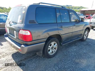 2003 Lexus LX with VIN JTJHT00W233532297, listed as a IAAI auction lot 42189676 with 235,992 mi miles. Bid and sale history available at carsss.com. Image 4.