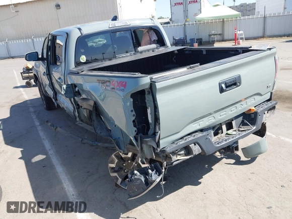 2022 Toyota Tacoma SR with VIN 3TMCZ5AN0NM489420, listed as a IAAI auction lot 42597175 with 129,340 mi miles and . Bid and sale history available at DreamBid. Image 3.