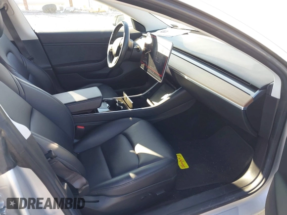 2018 Tesla Model 3 Long Range Battery with VIN 5YJ3E1EB9JF065057, listed as a IAAI auction lot 41863903 with 54,584 mi miles and . Bid and sale history available at DreamBid. Image 5.