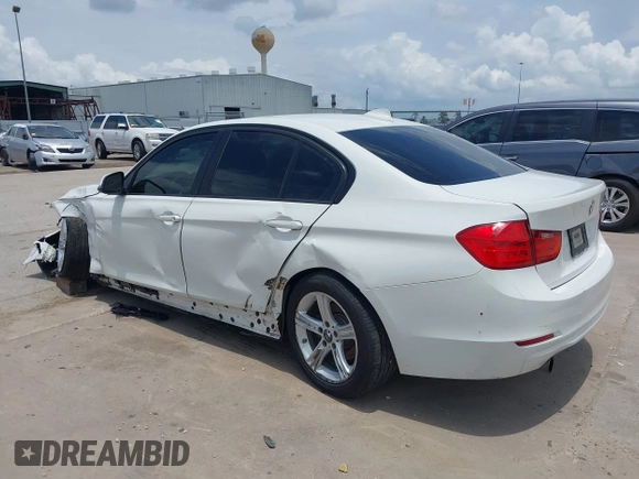 2013 BMW 3 Series 320i with VIN WBA3B1C50DK129576, listed as a IAAI auction lot 42393038 with 160,370 mi miles and . Bid and sale history available at DreamBid. Image 3.