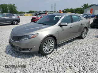 2015 Lincoln MKS with VIN 1LNHL9EK4FG600542, listed as a Copart auction lot 60450345 with 115,424 mi miles and Salvage title. Bid and sale history available at DreamBid. Image 1.