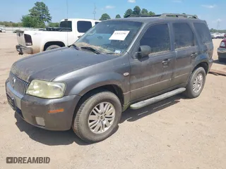 2005 Mercury Mariner Luxury with VIN 4M2CU57195DJ25103, listed as a IAAI auction lot 42032296 with 154,134 mi miles. Bid and sale history available at carsss.com. Image 2.