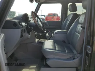 2002 Mercedes-Benz G 500 z VIN WDCYR49E12X133787, wystawiony jako Copart lot #54349175 z przebiegiem Nie podano mil oraz Tytuł czysty. Historia ofert i sprzedaży dostępna na DreamBid. Obrazek 7.