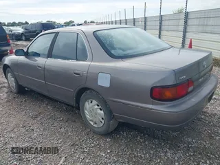 1996 Toyota Camry DX with VIN JT2BG12K1T0356821, listed as a IAAI auction lot 41860018 with 278,326 mi miles. Bid and sale history available at carsss.com. Image 3.