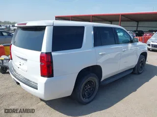 2020 Chevrolet Tahoe Commercial with VIN 1GNSKDEC8LR258254, listed as a IAAI auction lot 42104608 with 105,895 mi miles. Bid and sale history available at carsss.com. Image 4.