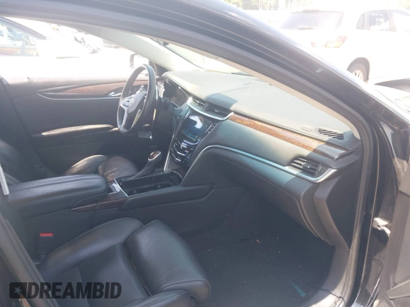 2013 Cadillac XTS Luxury z VIN 2G61P5S37D9101989, wystawiony jako IAAI lot #42242641 z przebiegiem 243 006 mil mil oraz . Historia ofert i sprzedaży dostępna na DreamBid. Obrazek 5.