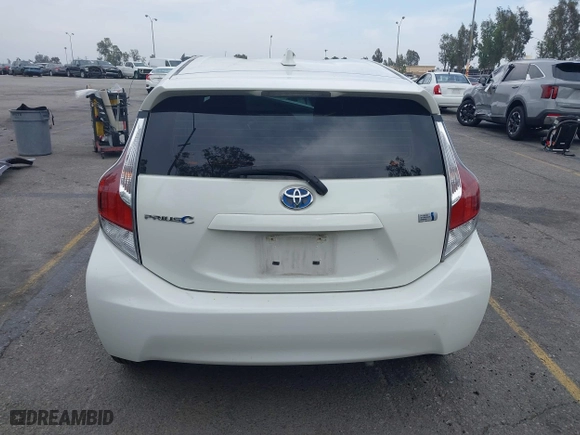 2015 Toyota Prius c One with VIN JTDKDTB3XF1097538, listed as a IAAI auction lot 42031057 with 100,847 mi miles. Bid and sale history available at carsss.com. Image 16.