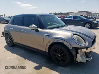 2017 MINI Hardtop 4 Door Cooper with VIN WMWXU1C53H2E18438, listed as a Copart auction lot 52871475 with 133,235 mi miles and Salvage Title. Bid and sale history available at DreamBid. Image 4.