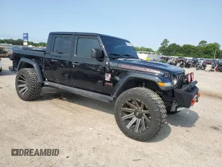 2020 Jeep Gladiator Rubicon with VIN 1C6JJTBG2LL166964, listed as a Copart auction lot 58041945 with 62,716 mi miles and Salvage title. Bid and sale history available at DreamBid. Image 4.