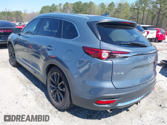 2021 Mazda CX-9 Carbon Edition with VIN JM3TCADY9M0517174, listed as a IAAI auction lot 41871485 with 48,484 mi miles and . Bid and sale history available at DreamBid. Image 3.