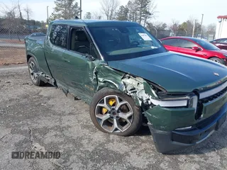 2022 Rivian R1T Adventure z VIN 7FCTGAAA8NN015369, wystawiony jako IAAI lot #41407842 z przebiegiem 22 507 mil mil oraz . Historia ofert i sprzedaży dostępna na DreamBid. Obrazek 6.