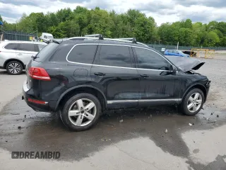 2012 Volkswagen Touareg Sport z VIN WVGEF9BP7CD009824, wystawiony jako Copart lot #58311915 z przebiegiem 154 397 mil mil oraz Szkoda całkowita • Salvage title. Historia ofert i sprzedaży dostępna na DreamBid. Obrazek 3.