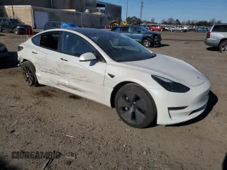 2023 Tesla Model 3 with VIN 5YJ3E1EA1PF556562, listed as a Copart auction lot 48413235 with 11,980 mi miles and Salvage Title. Bid and sale history available at DreamBid. Image 4.