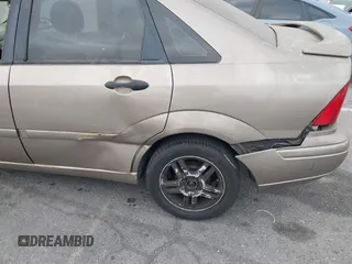 2003 Ford Focus SE z VIN 1FAFP34Z73W236474, wystawiony jako IAAI lot #39378102 z przebiegiem 183 280 mil mil oraz . Historia ofert i sprzedaży dostępna na DreamBid. Obrazek 6.