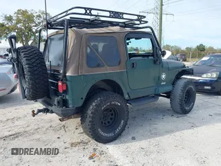 2000 Jeep Wrangler Sahara with VIN 1J4FA59SXYP743190, listed as a IAAI auction lot 41699142 with 1 mi miles. Bid and sale history available at carsss.com. Image 4.