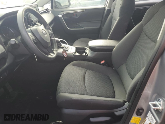 2019 Toyota RAV4 LE with VIN JTMG1RFV2KJ021318, listed as a Copart auction lot 46107385 with 57,863 mi miles and Salvage title. Bid and sale history available at DreamBid. Image 7.
