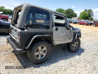 2002 Jeep Wrangler Sport with VIN 1J4FA49S42P720277, listed as a Copart auction lot 55856135 with Not provided miles and Salvage title. Bid and sale history available at DreamBid. Image 3.