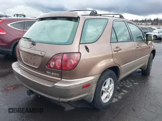 1999 Lexus RX 300 Luxury SUV with VIN JT6HF10U5X0061520, listed as a IAAI auction lot 41612890 with 254,864 mi miles. Bid and sale history available at carsss.com. Image 4.