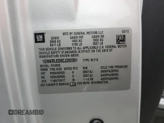 2012 Chevrolet Traverse LTZ z VIN 1GNKRLED8CJ262091, wystawiony jako Copart lot #55527805 z przebiegiem Nie podano mil oraz Szkoda całkowita • Salvage title. Historia ofert i sprzedaży dostępna na DreamBid. Obrazek 13.