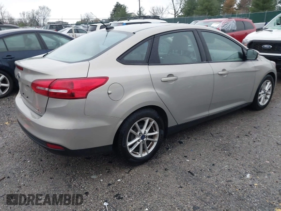 2015 Ford Focus SE with VIN 1FADP3F21FL376579, listed as a IAAI auction lot 41972088 with 129,593 mi miles. Bid and sale history available at carsss.com. Image 4.