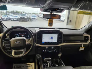 2023 Ford F-150 Lightning Pro with VIN 1FT6W1EV1PWG31060, listed as a IAAI auction lot 42141702 with 152 mi miles. Bid and sale history available at carsss.com. Image 1.