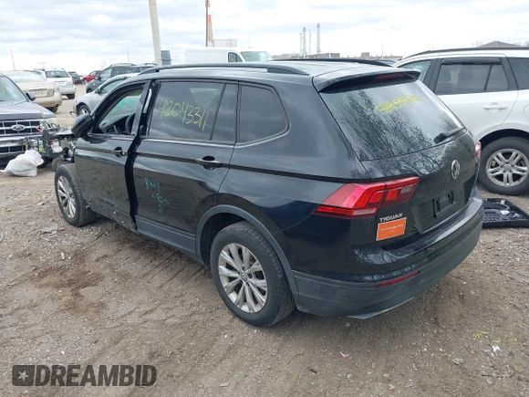 2018 Volkswagen Tiguan S with VIN 3VV1B7AX1JM076071, listed as a IAAI auction lot 42043311 with 107,883 mi miles and . Bid and sale history available at DreamBid. Image 3.