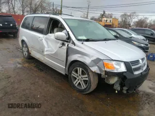 2010 Dodge Grand Caravan SXT with VIN 2D4RN5DX1AR127914, listed as a IAAI auction lot 41720511 with 169,953 mi miles and . Bid and sale history available at DreamBid. Image 1.