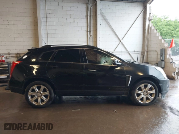 2014 Cadillac SRX Performance Collection with VIN 3GYFNFE39ES659013, listed as a IAAI auction lot 42264069 with 129,122 mi miles and . Bid and sale history available at DreamBid. Image 13.