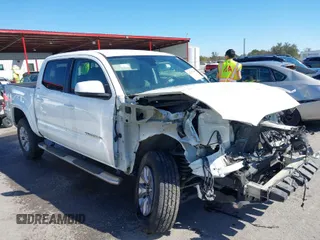 2018 Toyota Tacoma SR5 with VIN 5TFAZ5CN4JX056465, listed as a IAAI auction lot 41767848 with 71,532 mi miles and . Bid and sale history available at DreamBid. Image 1.