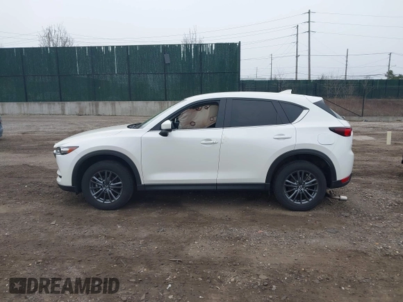 2021 Mazda CX-5 Touring with VIN JM3KFBCM1M1446313, listed as a IAAI auction lot 41930330 with 28,610 mi miles. Bid and sale history available at carsss.com. Image 14.