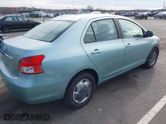 2009 Toyota Yaris with VIN JTDBT903794060474, listed as a IAAI auction lot 42005903 with 104,607 mi miles. Bid and sale history available at carsss.com. Image 4.