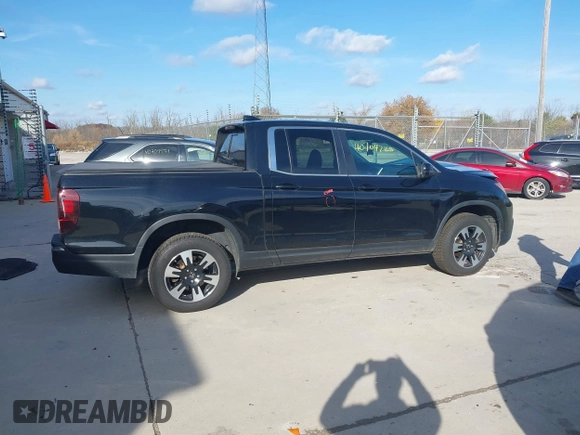 2020 Honda Ridgeline RTL with VIN 5FPYK3F59LB023212, listed as a IAAI auction lot 40704228 with 73,259 mi miles and . Bid and sale history available at DreamBid. Image 14.
