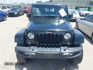 2015 Jeep Wrangler Unlimited Sahara with VIN 1C4HJWEG6FL572674, listed as a IAAI auction lot 42736266 with 97,024 mi miles and . Bid and sale history available at DreamBid. Image 12.