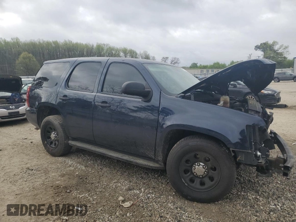 2014 Chevrolet Tahoe Commercial with VIN 1GNLC2E08ER209599, listed as a Copart auction lot 51018165 with 111,585 mi miles and Salvage title. Bid and sale history available at DreamBid. Image 4.