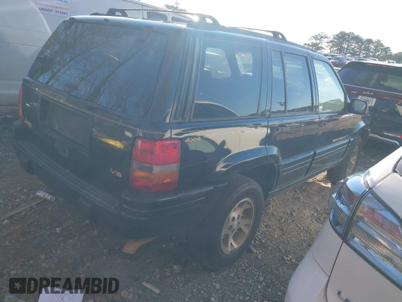 1997 Jeep Grand Cherokee Limited with VIN 1J4GZ78Y7VC688375, listed as a IAAI auction lot 41255946 with 216,544 mi miles. Bid and sale history available at carsss.com. Image 4.