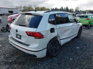2023 Volkswagen Tiguan SE R-Line Black with VIN 3VVCB7AX3PM014446, listed as a IAAI auction lot 42016885 with 12,726 mi miles and . Bid and sale history available at DreamBid. Image 4.