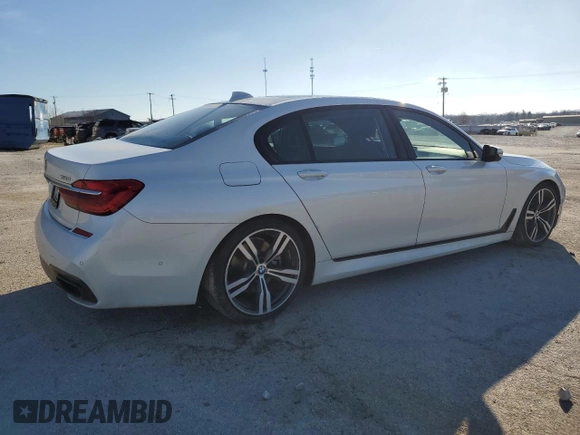 2017 BMW 7 Series 750i with VIN WBA7F0C39HGM22030, listed as a Copart auction lot 87127484 with 110,634 mi miles and Salvage title. Bid and sale history available at DreamBid. Image 3.