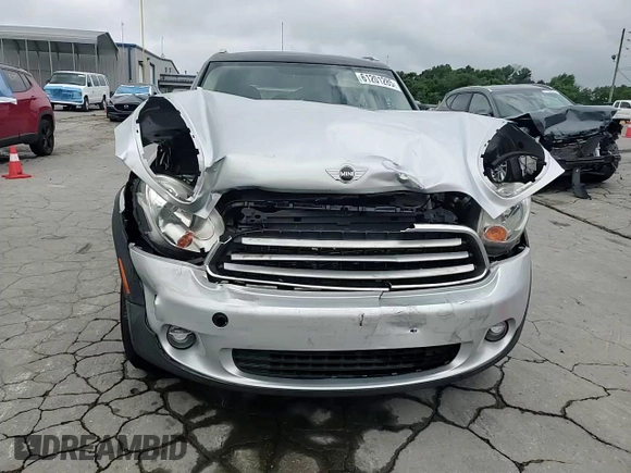2012 MINI Countryman with VIN WMWZB3C5XCWM06778, listed as a Copart auction lot 61201285 with 64,676 mi miles and Salvage title. Bid and sale history available at DreamBid. Image 13.