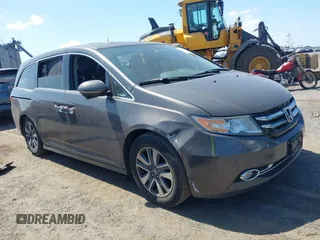2014 Honda Odyssey Touring with VIN 5FNRL5H90EB082691, listed as a IAAI auction lot 42572977 with 54,413 mi miles and . Bid and sale history available at DreamBid. Image 1.