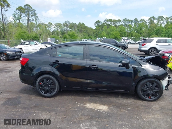 2014 Kia Rio LX with VIN KNADM4A33E6335499, listed as a IAAI auction lot 42123085 with 148,146 mi miles and . Bid and sale history available at DreamBid. Image 13.